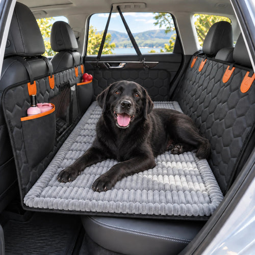 Black Labrador resting on the RoadNest extender and removable grey Comfort Topper